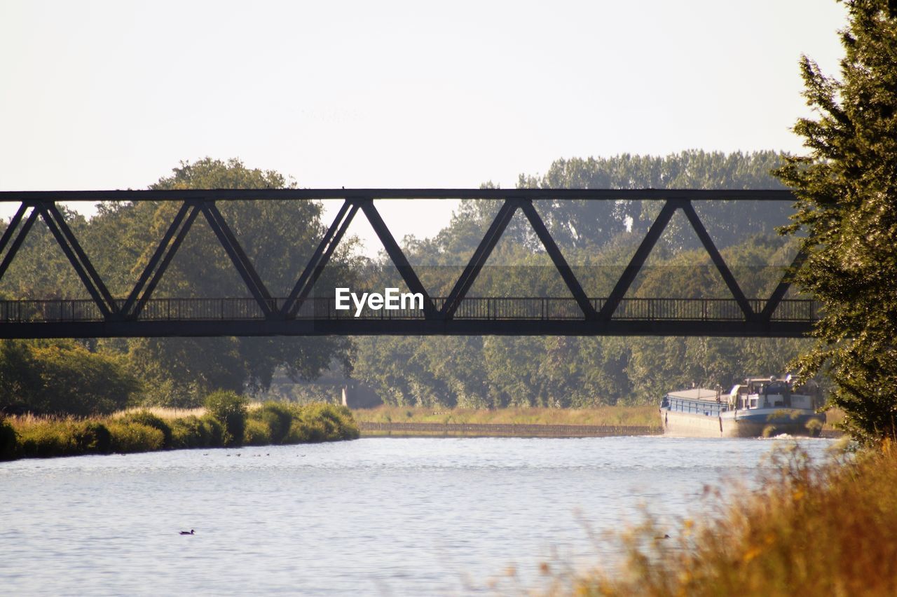 Bridge over river against clear sky