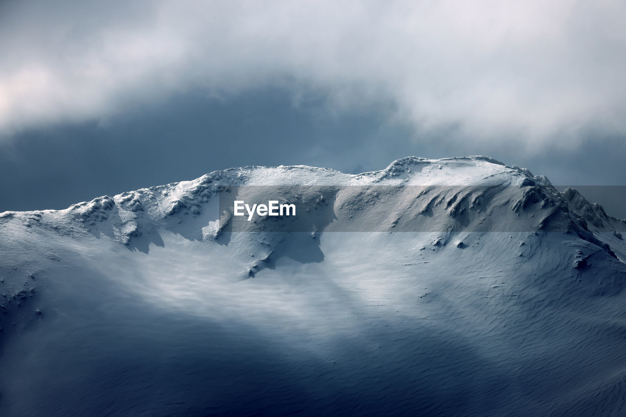 scenic view of snow covered mountain against sky