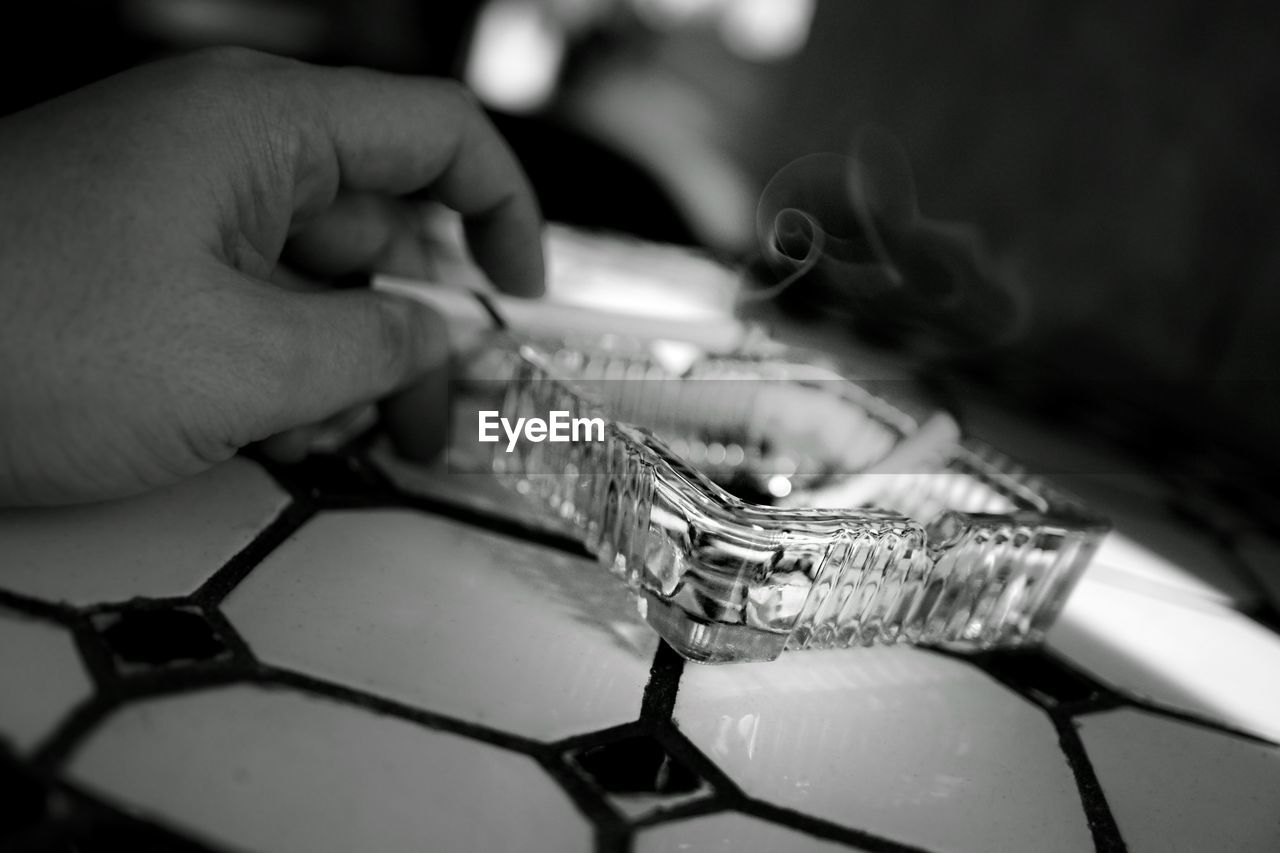 Close-up of ashtray on table