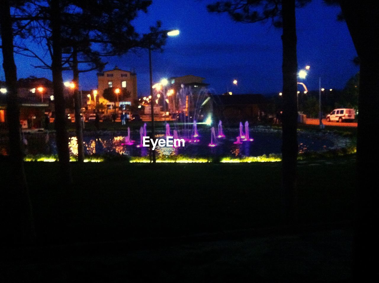 VIEW OF ILLUMINATED STREET LIGHT AT NIGHT