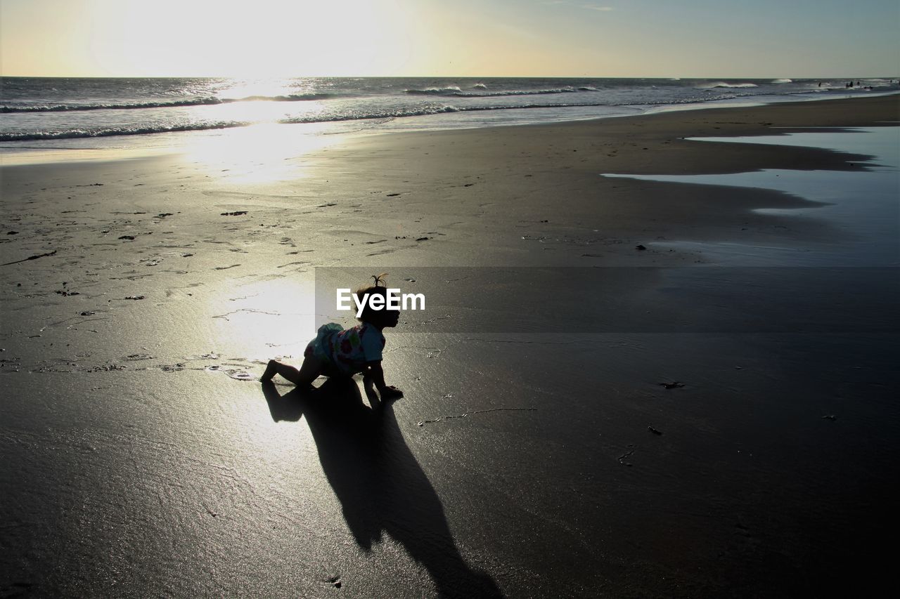 FULL LENGTH OF MAN ON BEACH