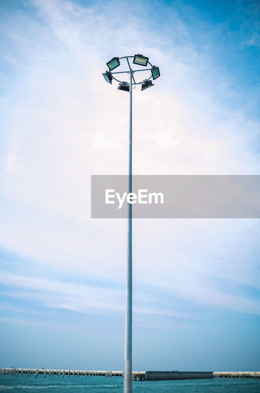 Low angle view of street light against sky