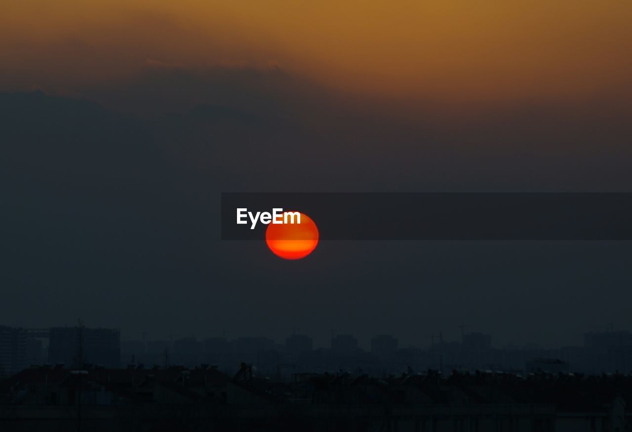 Scenic view of moon against sky during sunset