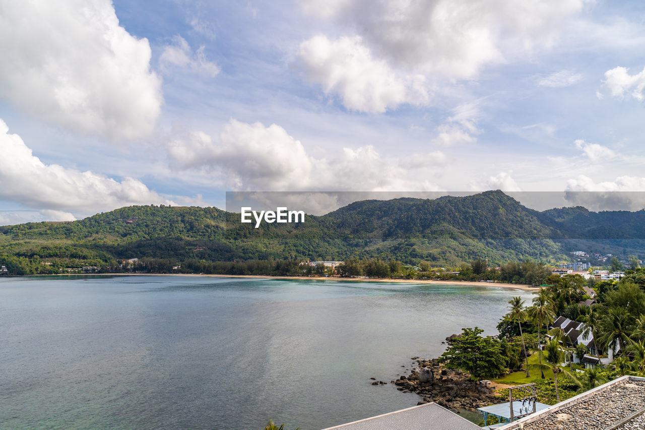 View of the beautiful andaman sea with fluffy wihte clouds in phuket, thailand