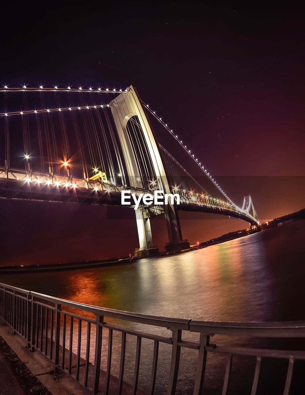 Bridge over river at night