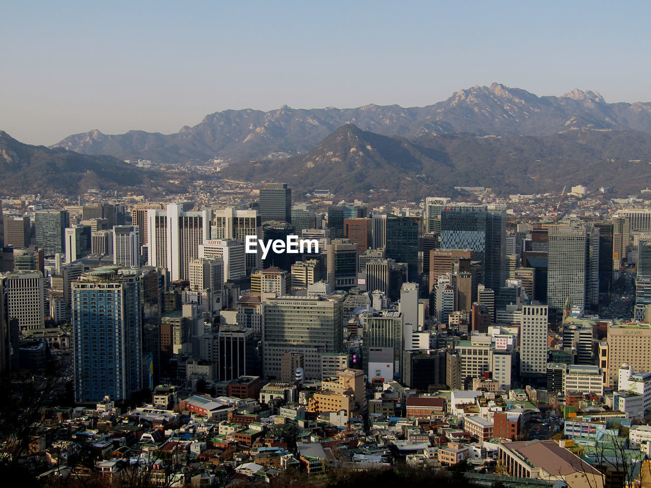 High angle view of buildings in city against clear sky