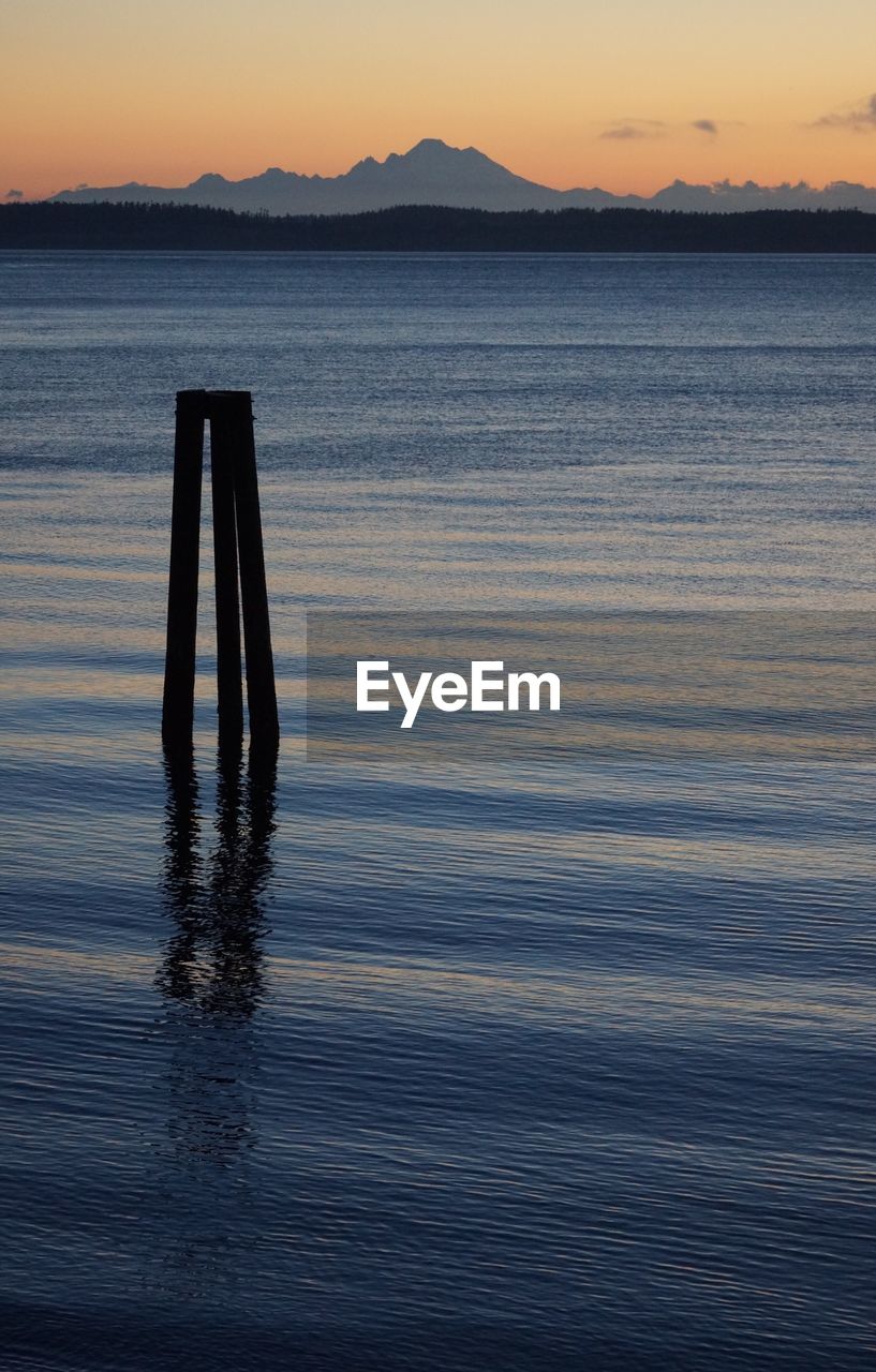 Scenic view of sea against sky at sunset