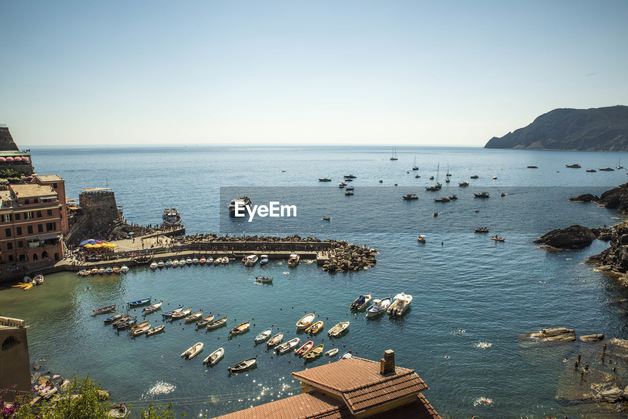 High angle view of boats in sea against sky