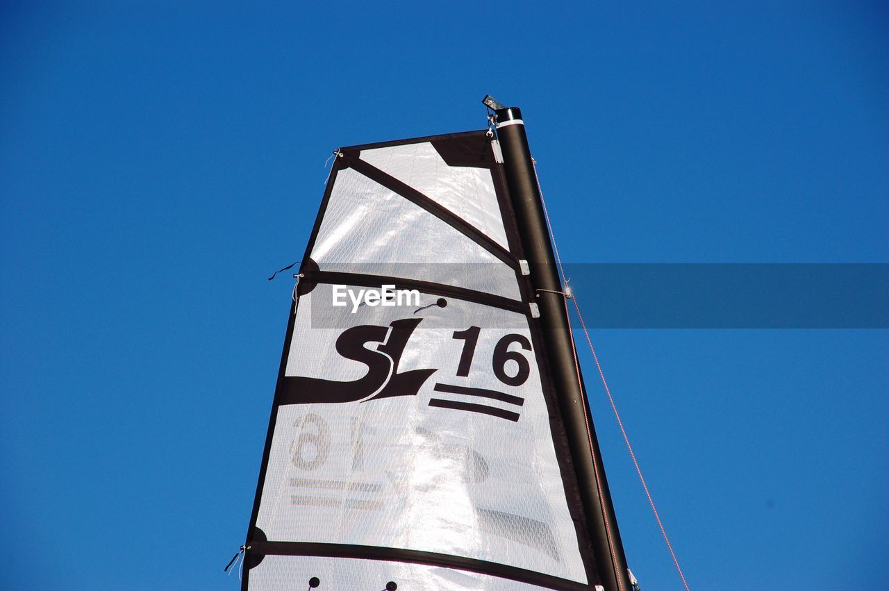 LOW ANGLE VIEW OF INFORMATION SIGN AGAINST SKY