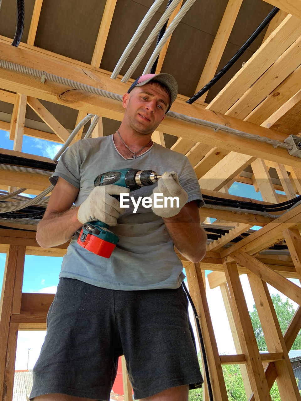LOW ANGLE VIEW OF MAN WORKING
