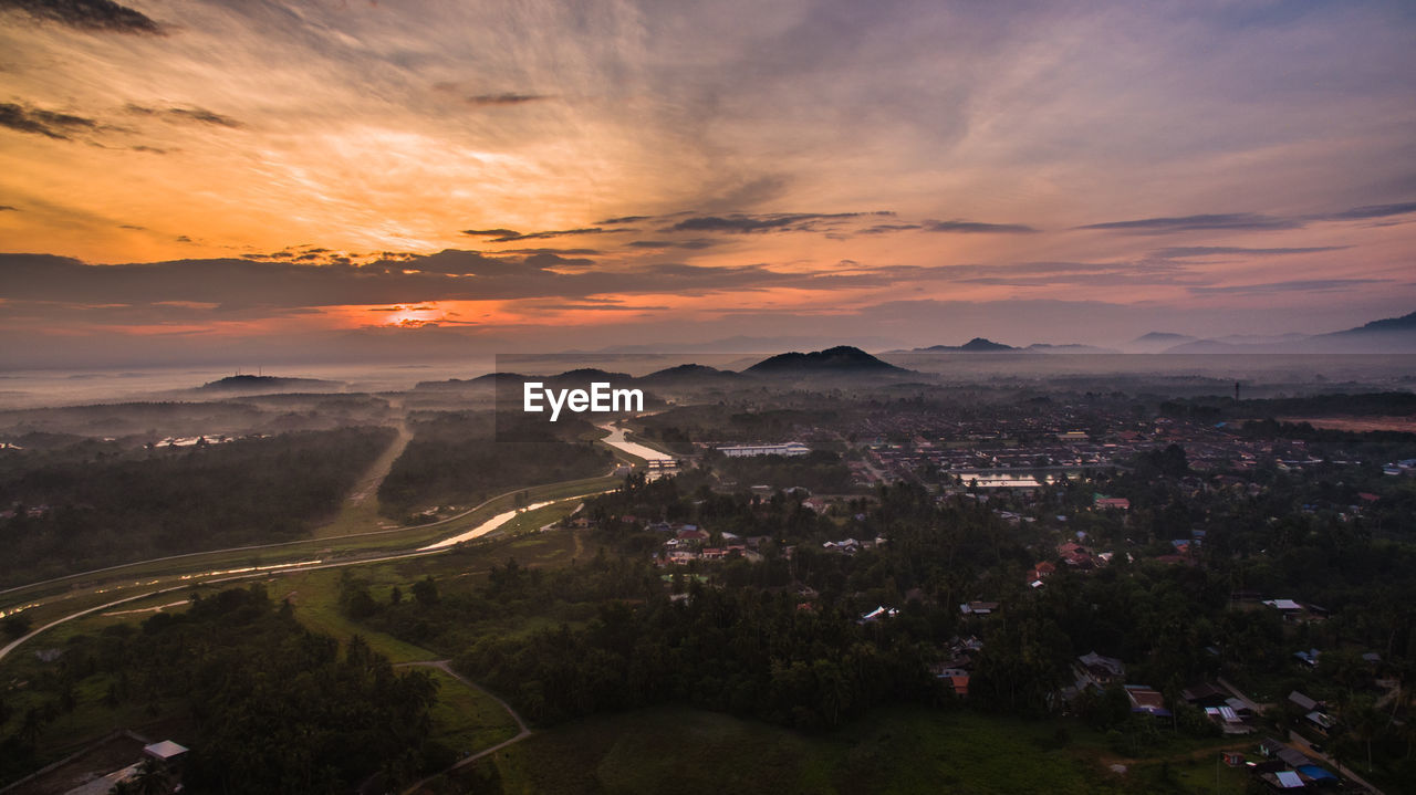 High angle view of cityscape against sky at sunset