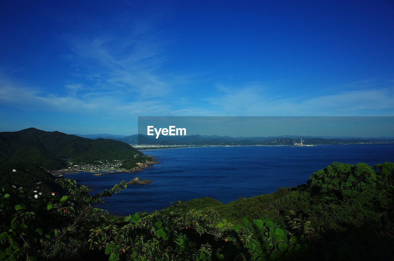 SCENIC VIEW OF BAY AGAINST CLEAR BLUE SKY