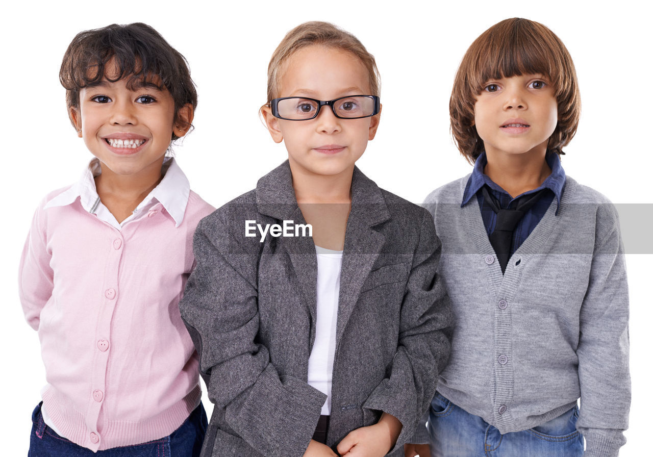 white background, studio shot, child, portrait, men, looking at camera, group of people, female, cut out, indoors, women, outerwear, smiling, childhood, clothing, person, team, emotion, shirt, adult, happiness, friendship, casual clothing, sleeve, togetherness, front view, eyeglasses, positive emotion, waist up, student, small group of people, cute, business, arms crossed, jeans, standing, glasses, human face, cheerful, looking, dress shirt, relaxation