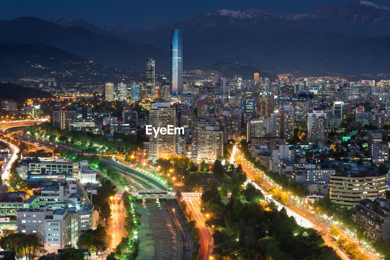 High angle view of illuminated city buildings at night