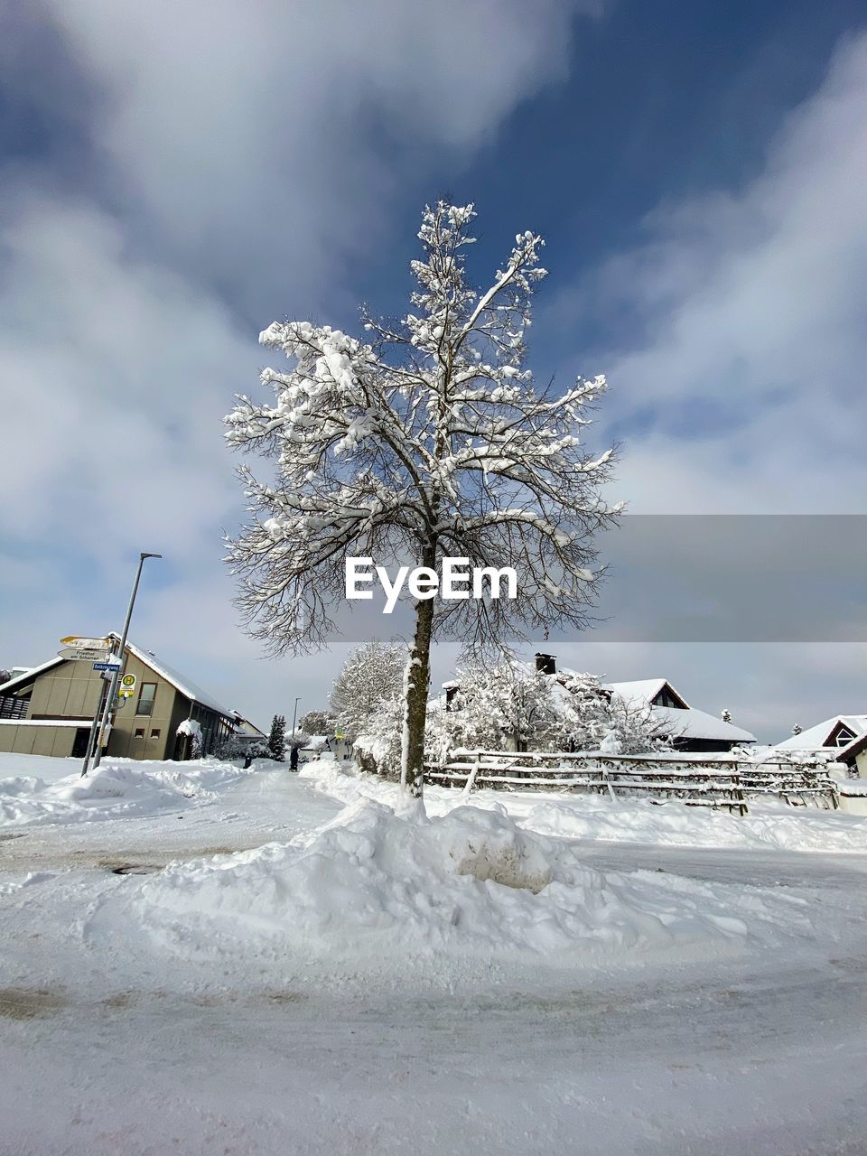 SNOW COVERED FIELD AGAINST SKY