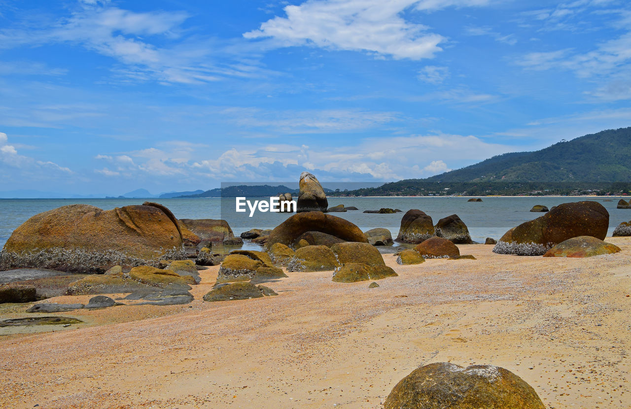 Scenic view of sea against cloudy sky