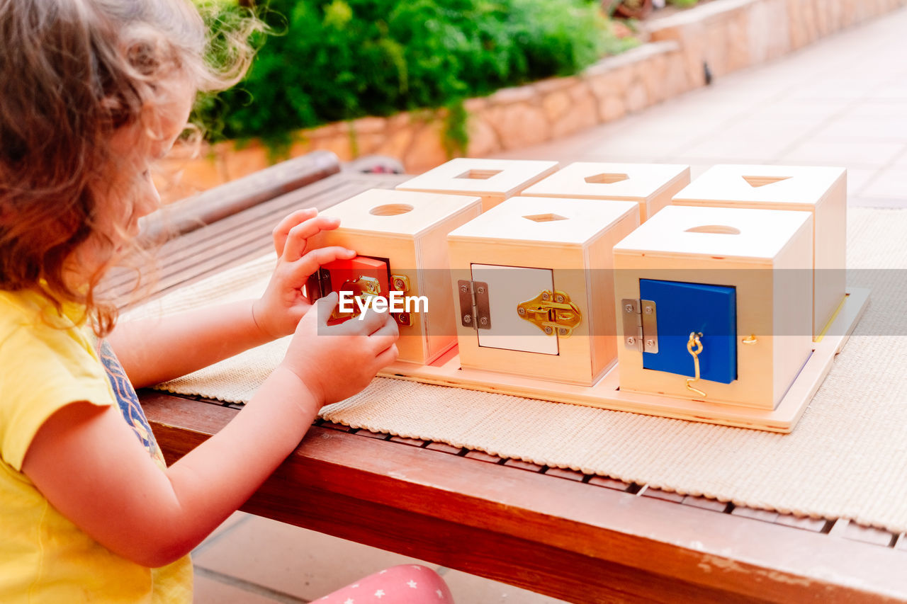 Wooden boxes with locks, educational montessori material to manipulate objects by children
