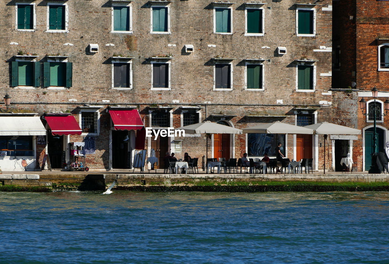 VIEW OF BUILDINGS BY CANAL