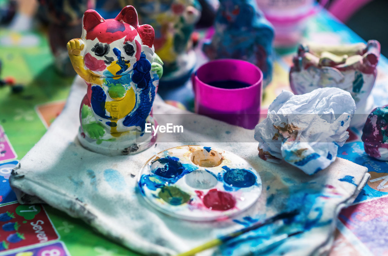 multi colored, craft, creativity, no people, paint, table, toy, party, still life, representation, celebration, palette, selective focus, sweetness, blue