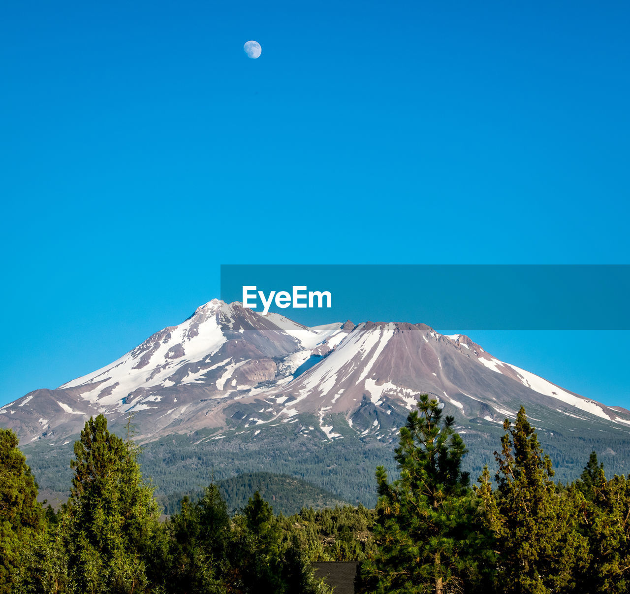 Scenic view of mt shasta against clear blue sky