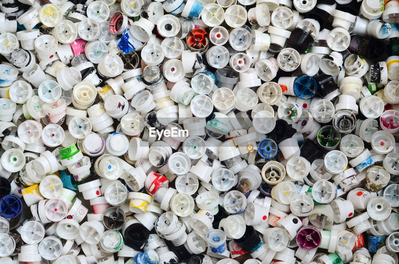 Full frame shot of abandoned spray bottle caps