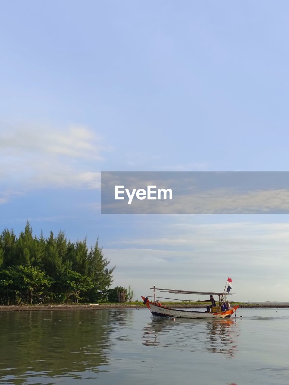 water, nautical vessel, sky, transportation, boat, nature, mode of transportation, vehicle, boating, sea, cloud, shore, tree, plant, beauty in nature, men, watercraft, day, tranquility, scenics - nature, bay, outdoors, reflection, waterfront, oar, travel, paddle, tranquil scene, two people, kayak, tropical climate, beach, adult, canoe, palm tree, occupation, non-urban scene, land