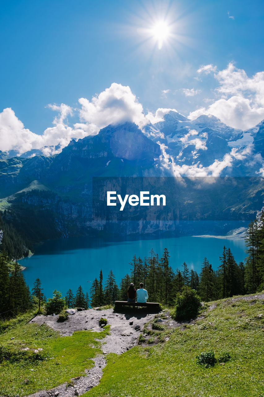 SCENIC VIEW OF LAKE AGAINST SKY ON SUNNY DAY