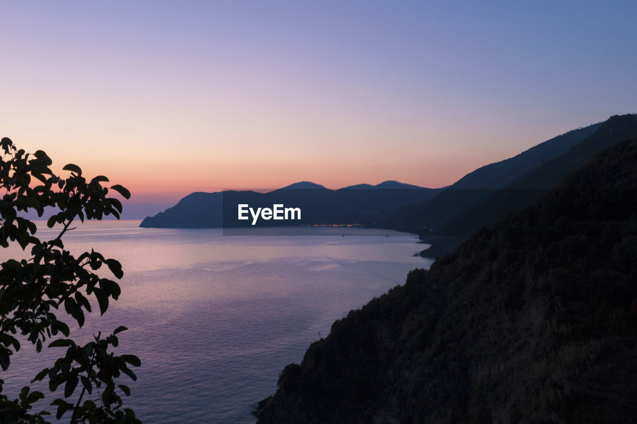 Scenic view of sea against clear sky during sunset