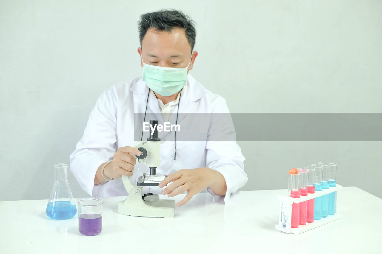 Scientist working at table in laboratory