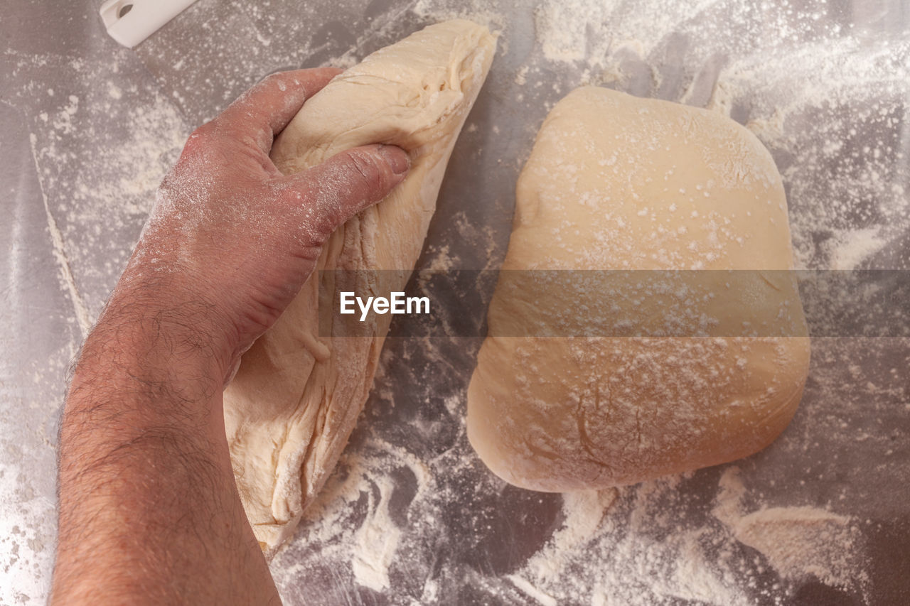 Close-up of person preparing bread