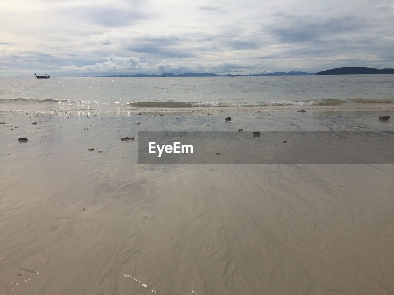 VIEW OF BEACH AGAINST THE SKY