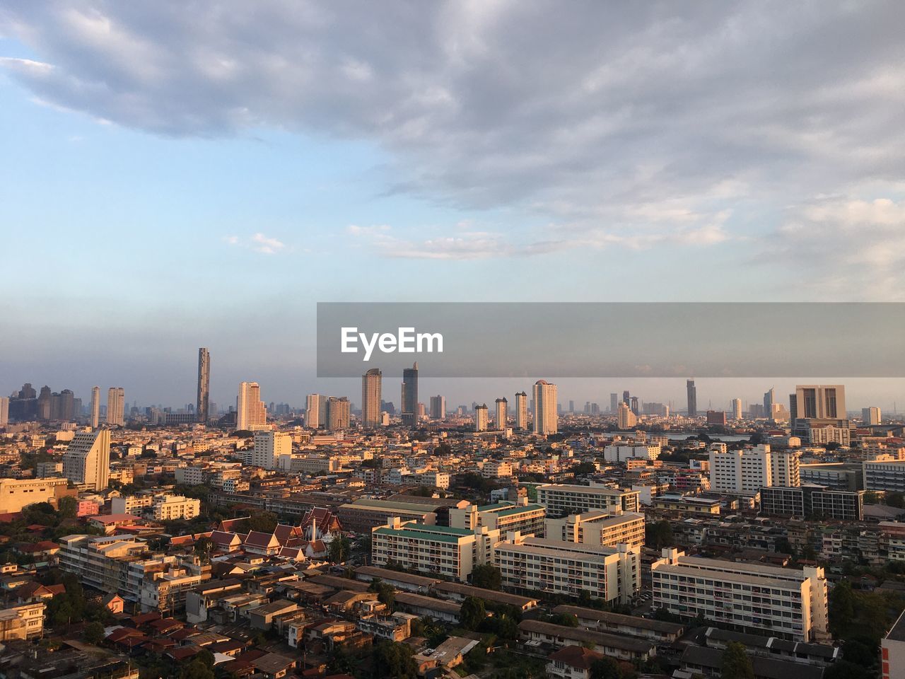 Aerial view of modern buildings in city against sky