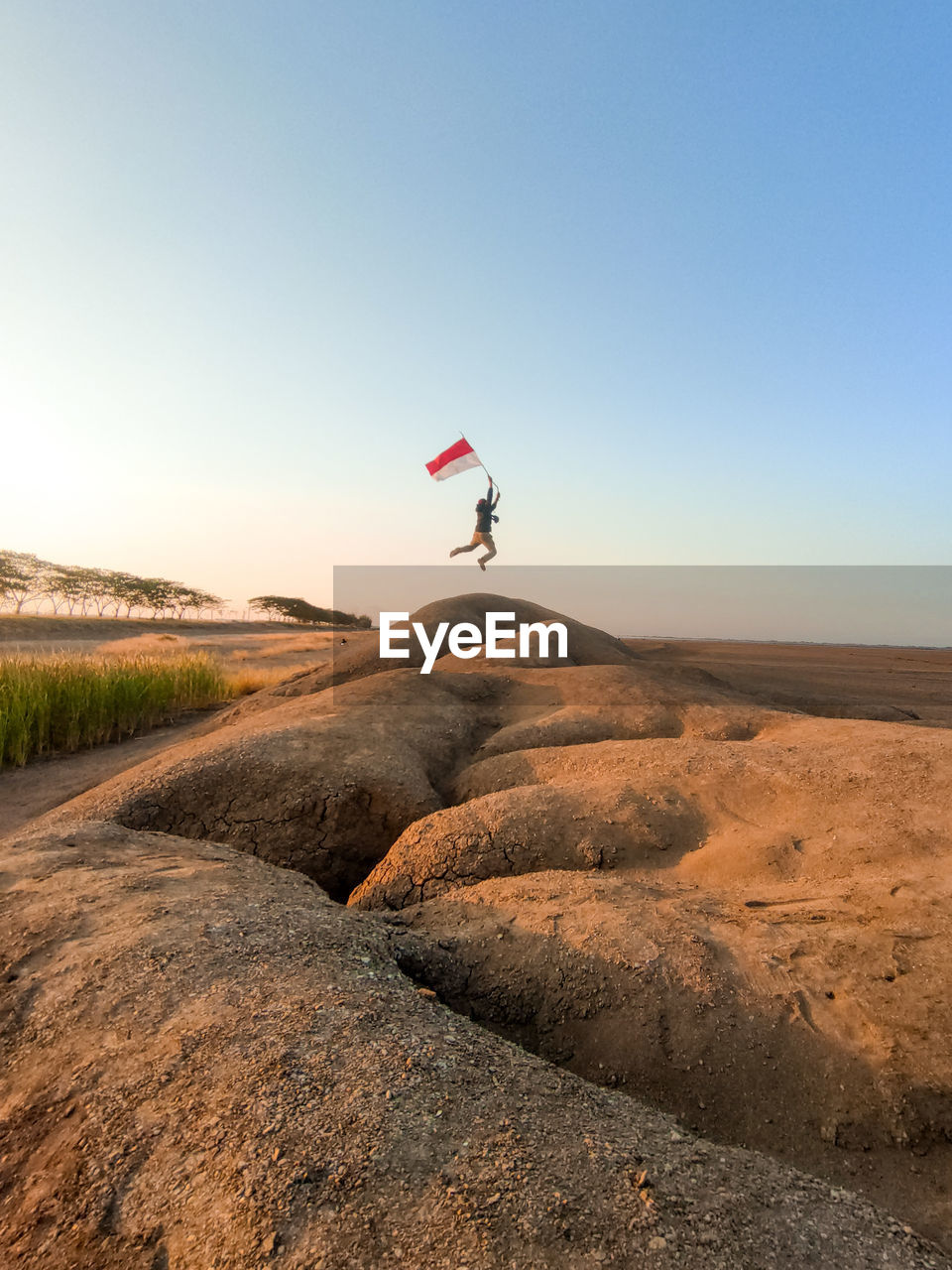 Scenic view of land against clear sky