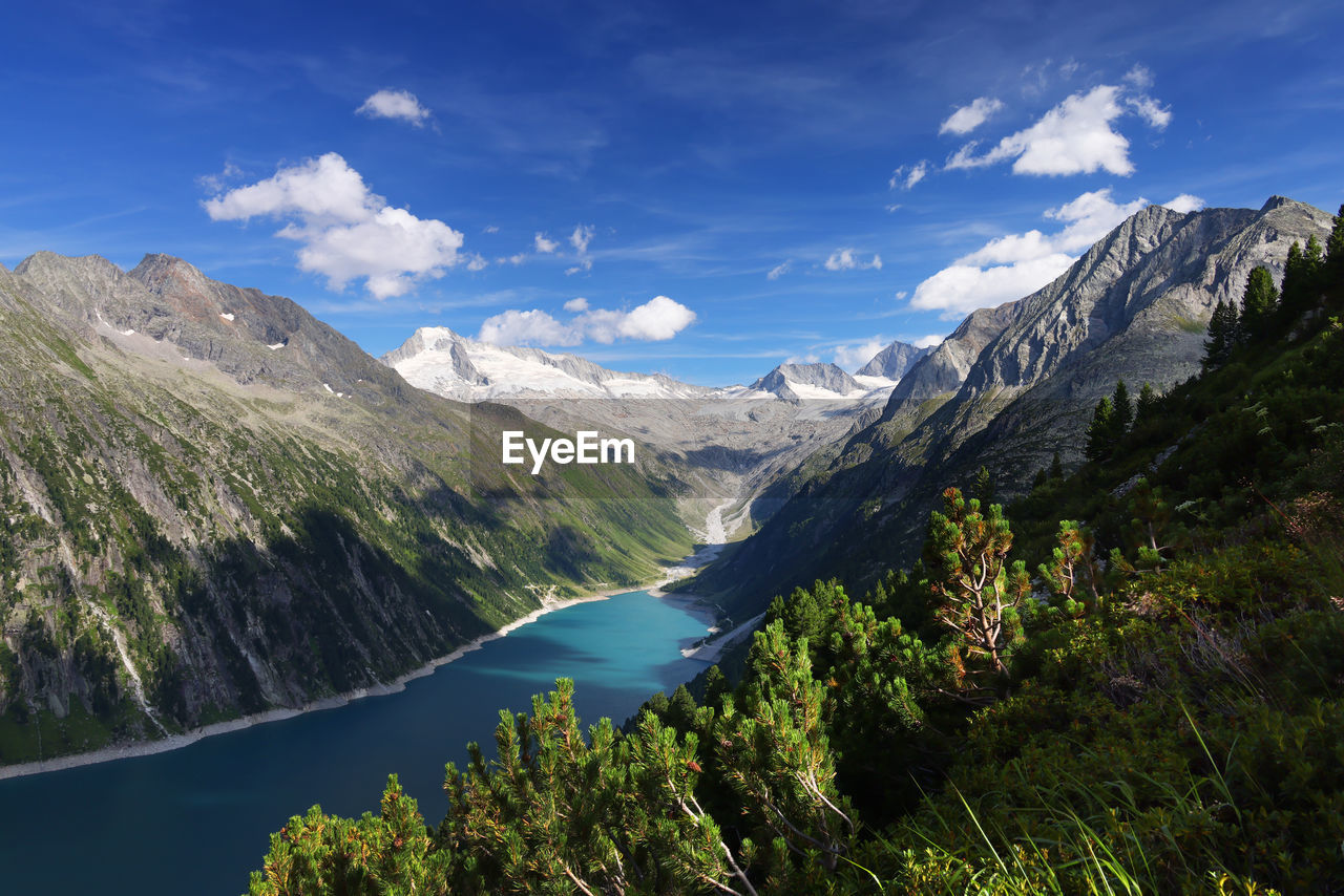 scenic view of lake and mountains against sky