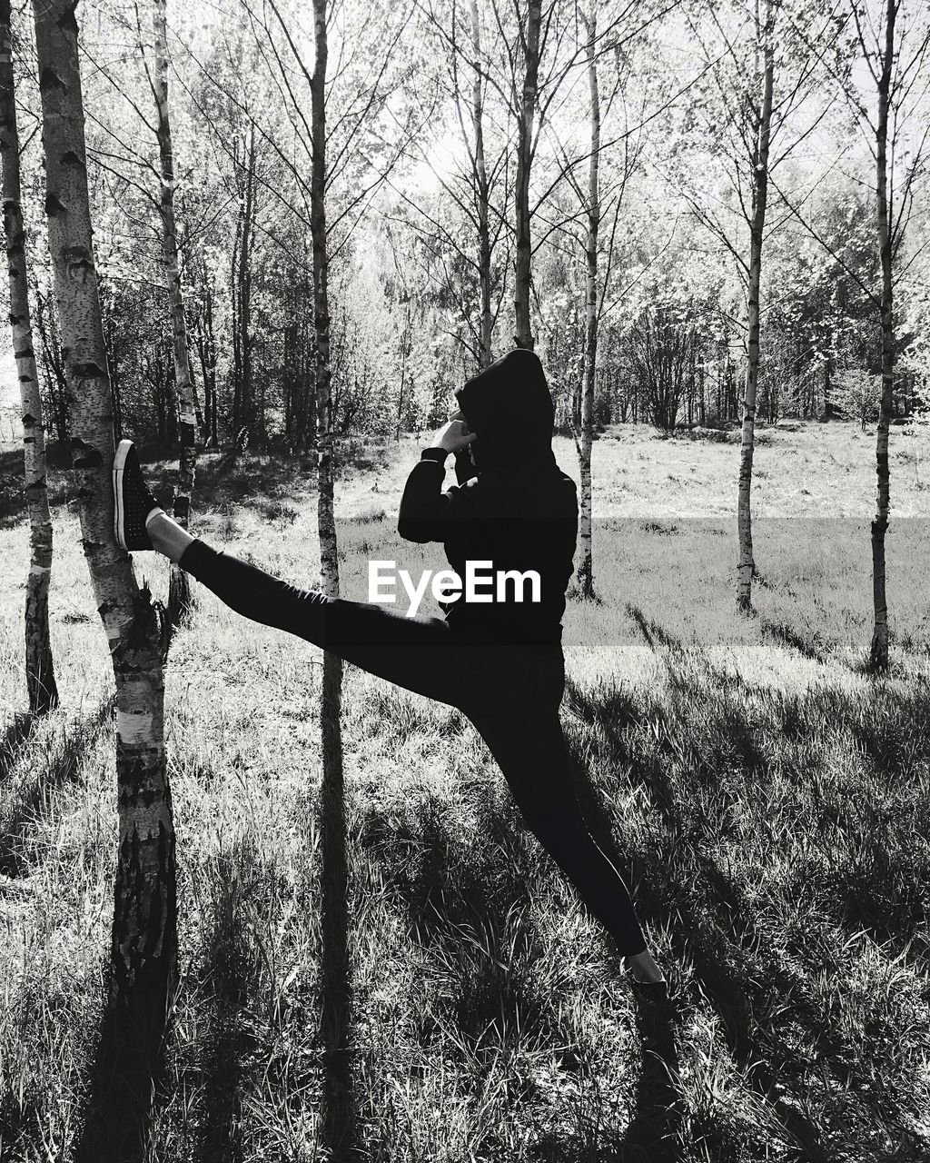 SILHOUETTE MAN PHOTOGRAPHING ON FIELD