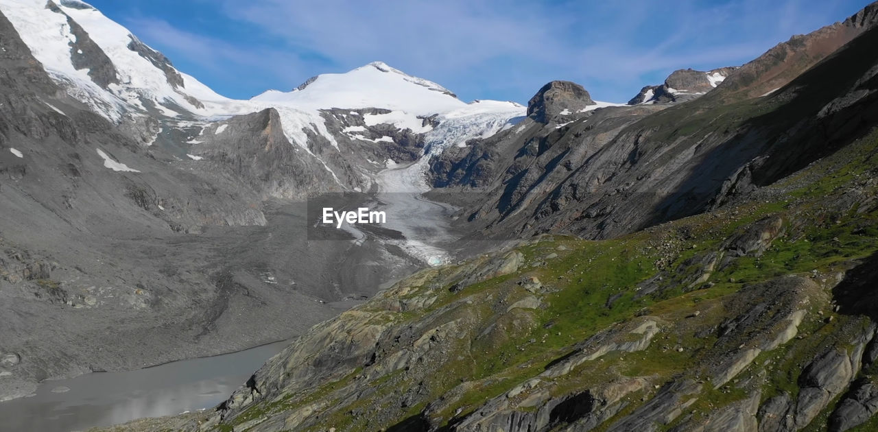 SCENIC VIEW OF SNOWCAPPED MOUNTAINS AGAINST SKY DURING WINTER