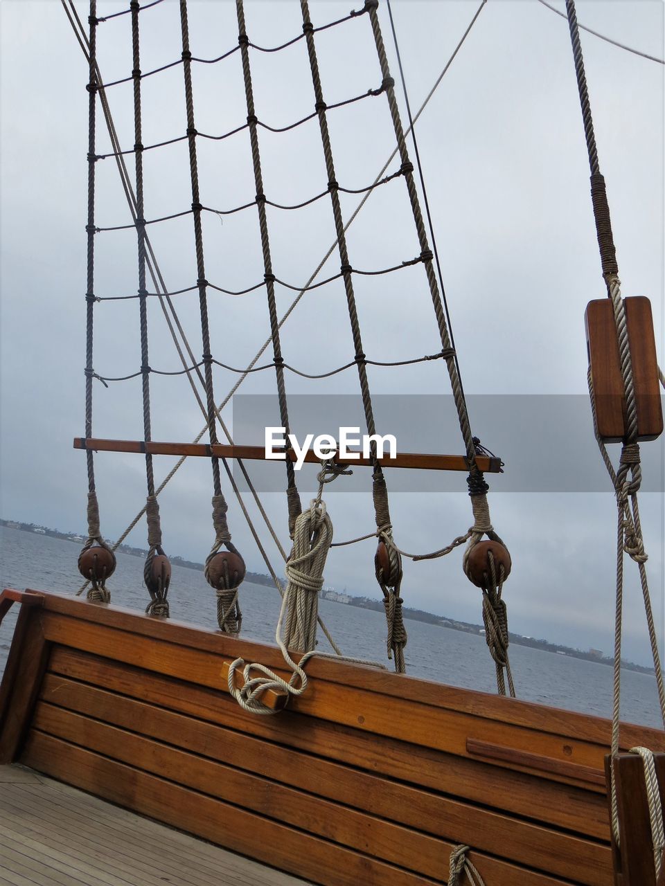 LOW ANGLE VIEW OF SAILBOAT AGAINST SKY AT SEA