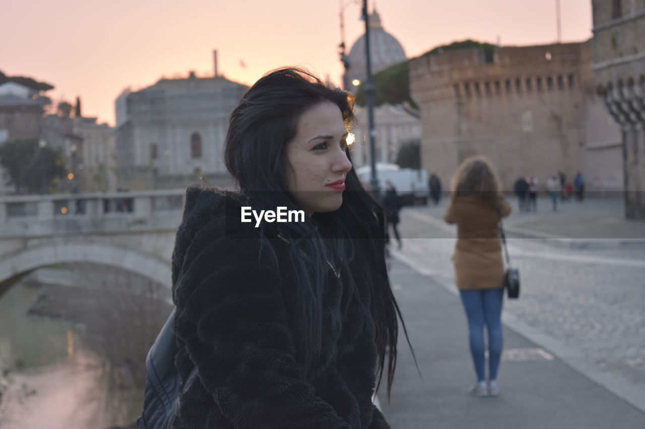 Woman standing in city