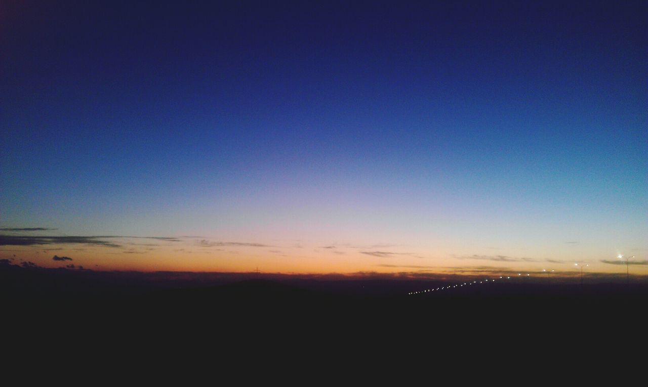 SCENIC VIEW OF LANDSCAPE AT SUNSET