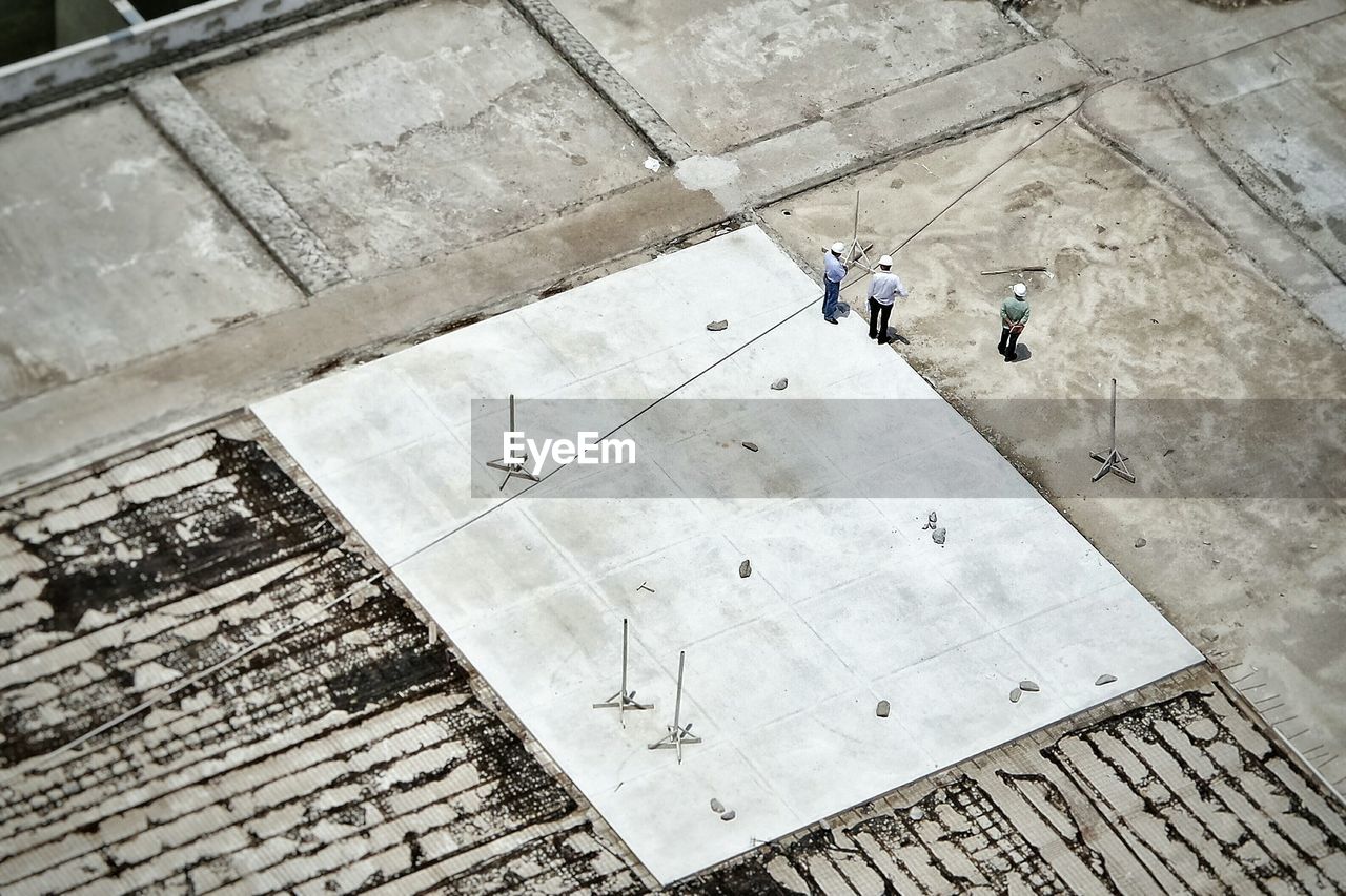 Aerial view of construction workers standing at construction site
