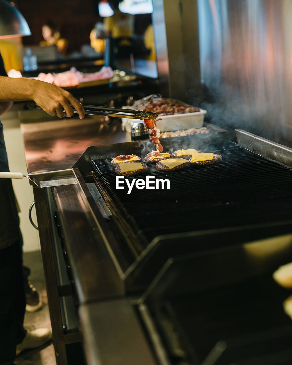 HIGH ANGLE VIEW OF MEAT ON BARBECUE GRILL AT KITCHEN