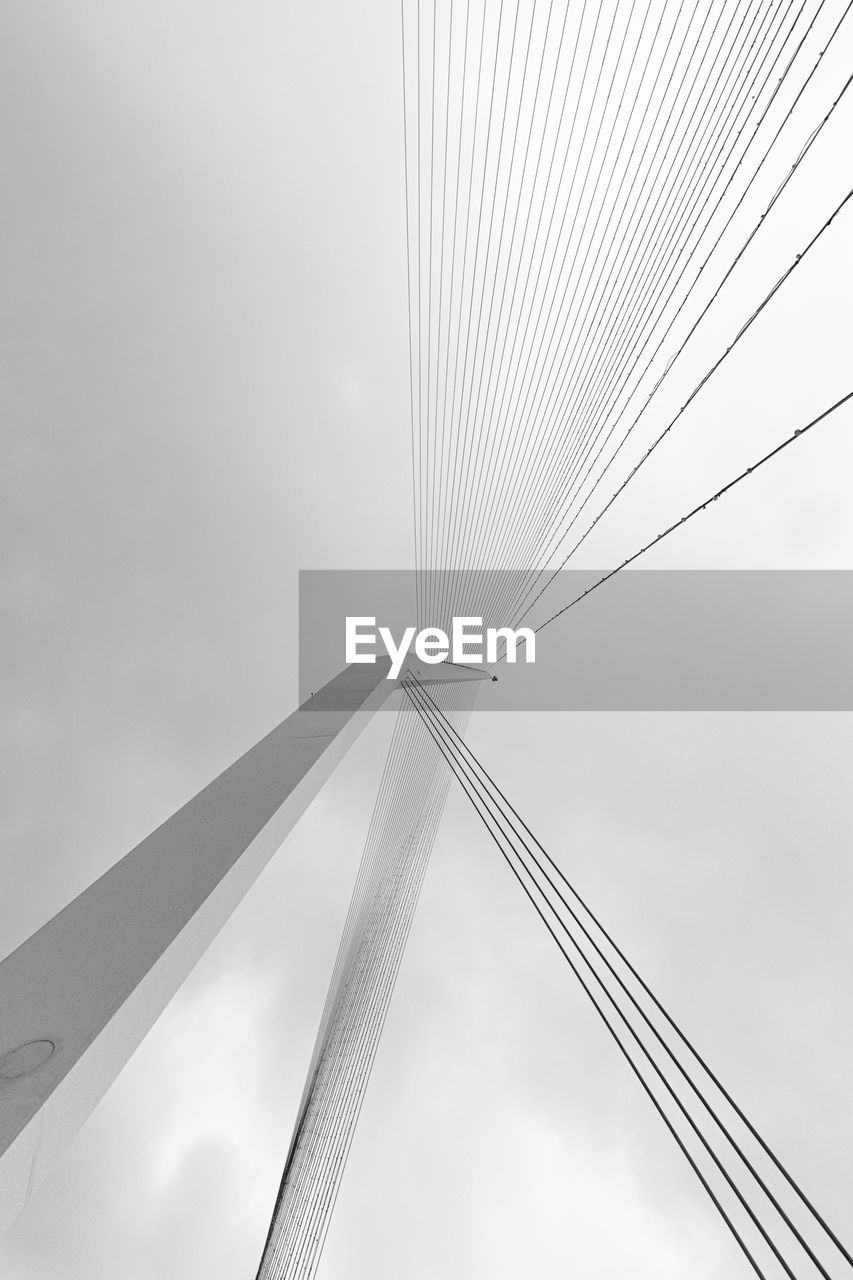line, sky, black and white, cloud, architecture, built structure, no people, monochrome, nature, monochrome photography, wing, city, outdoors, wind, low angle view, white, skyscraper, bridge, transportation, metal, day, abstract, pattern, cable