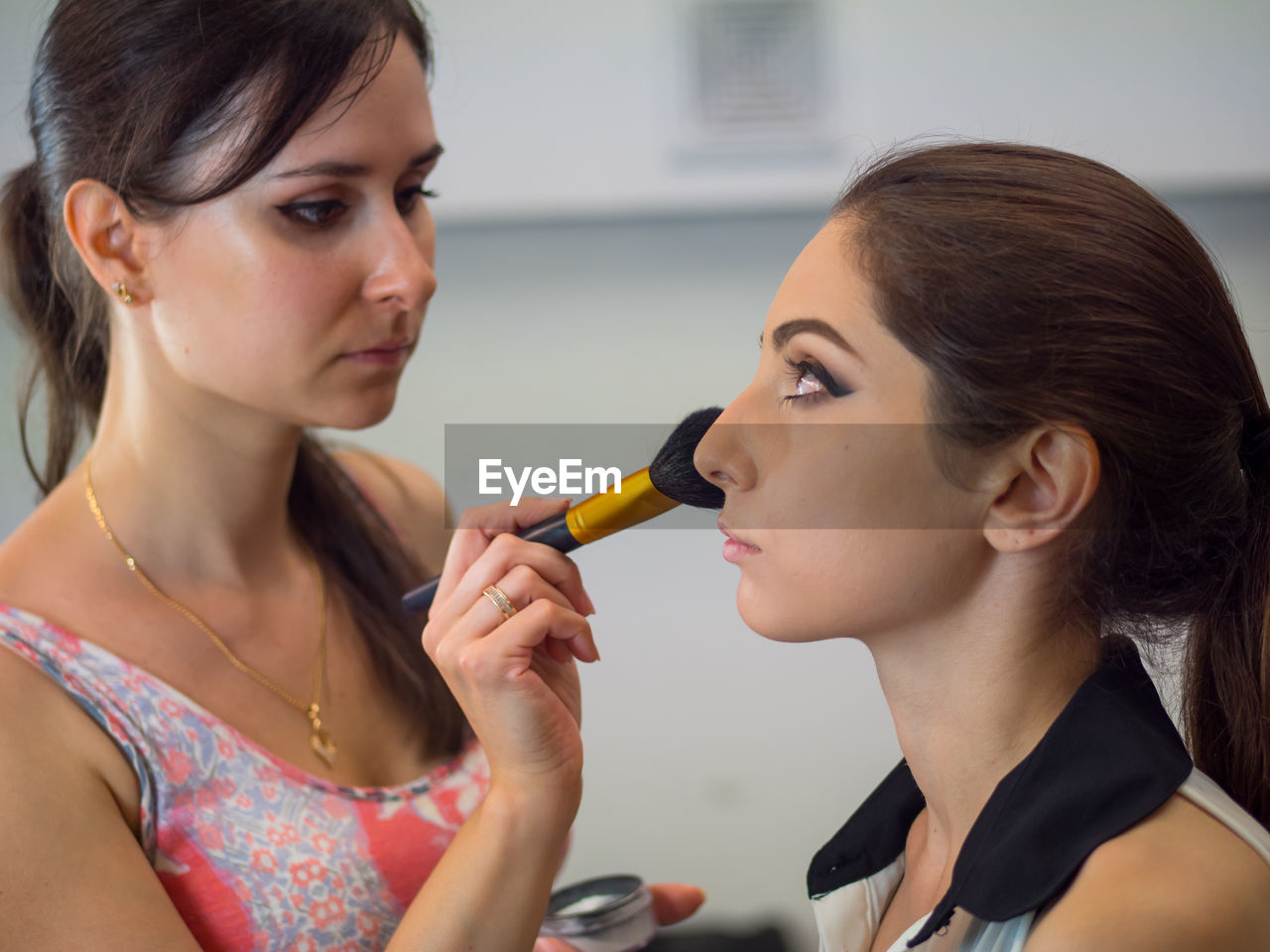 Beautician dressing customer at spa