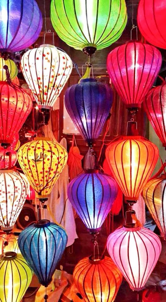 LOW ANGLE VIEW OF MULTI COLORED LANTERNS HANGING ON CEILING