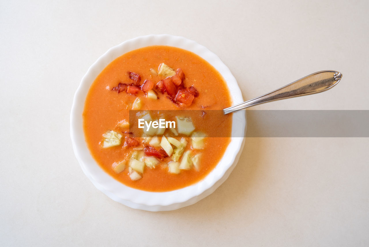 Andalusian gazpacho soup in white bowl