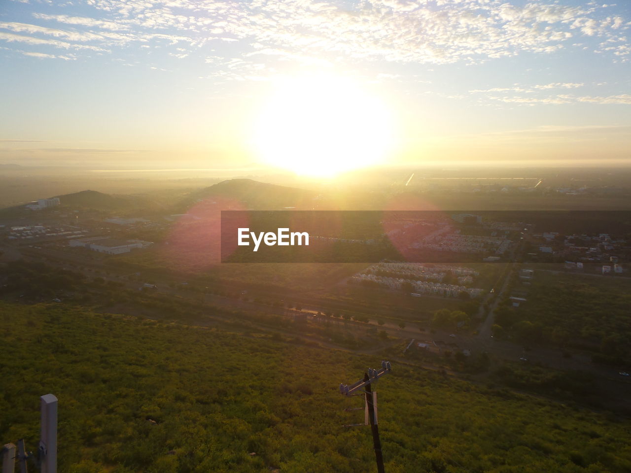 HIGH ANGLE VIEW OF CITY DURING SUNSET