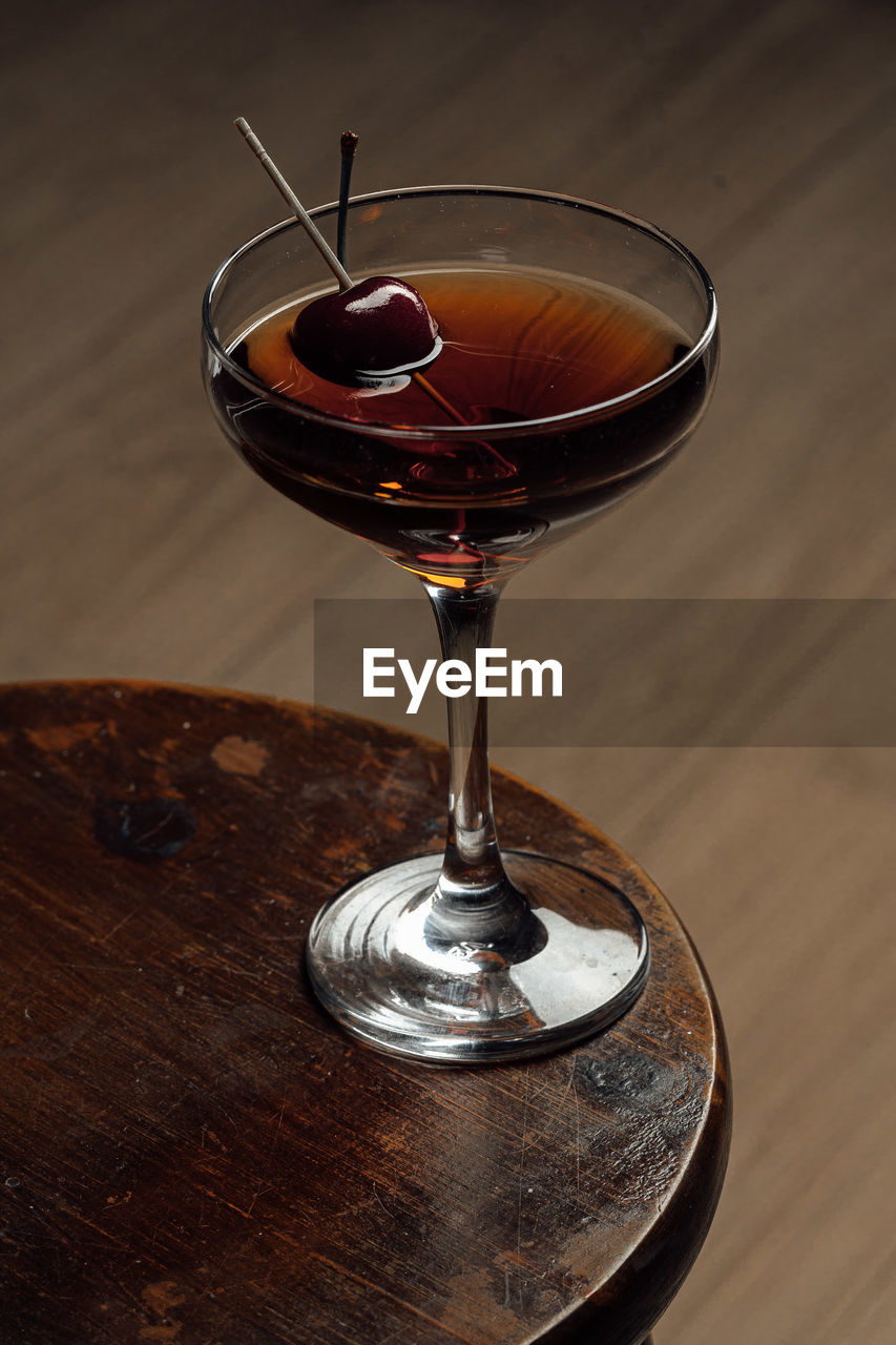alcohol, food and drink, drink, glass, refreshment, alcoholic beverage, wood, distilled beverage, wine, wine glass, drinking glass, cocktail, no people, indoors, household equipment, table, food, martini, still life