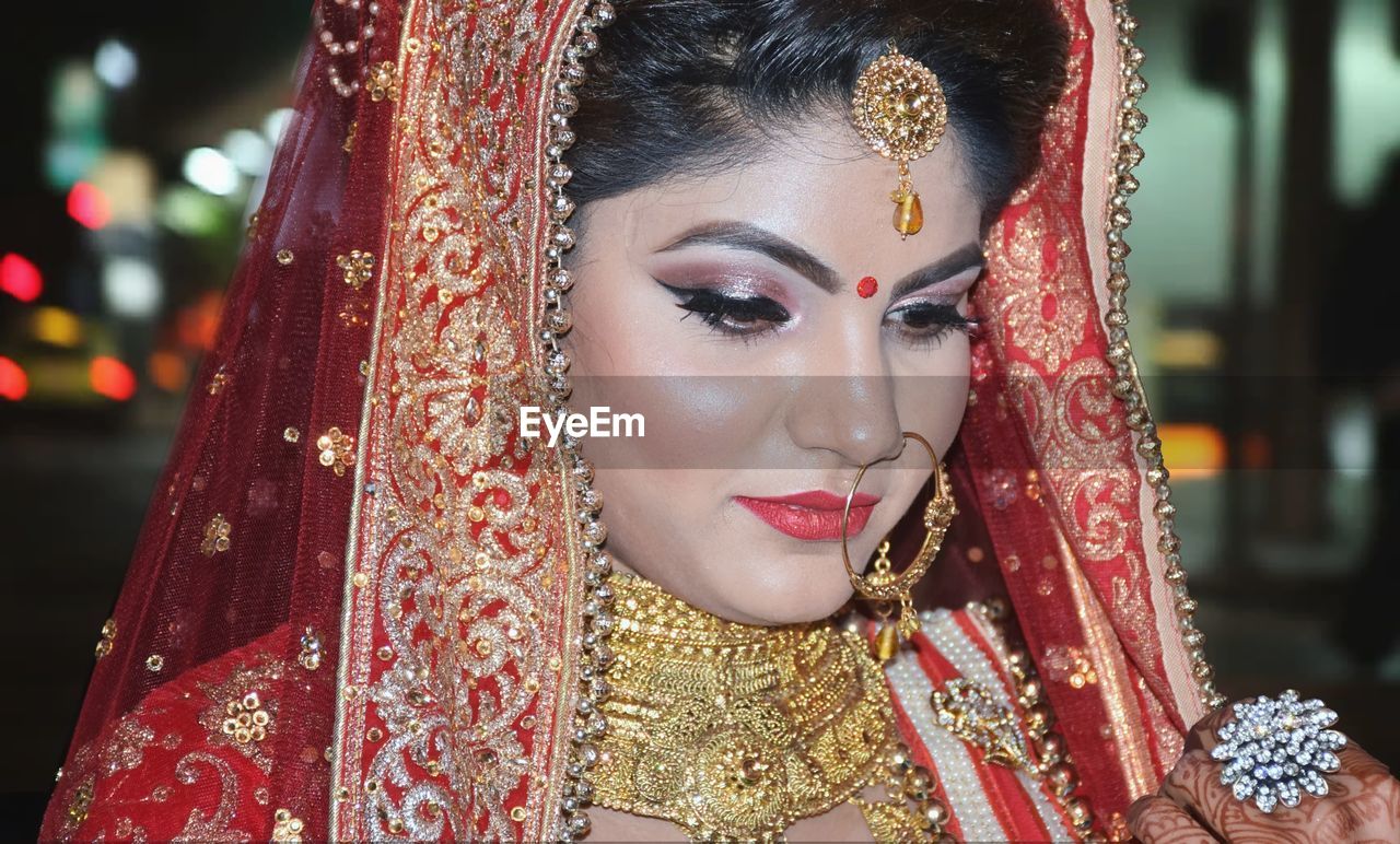 Close-up of young bride in traditional clothing