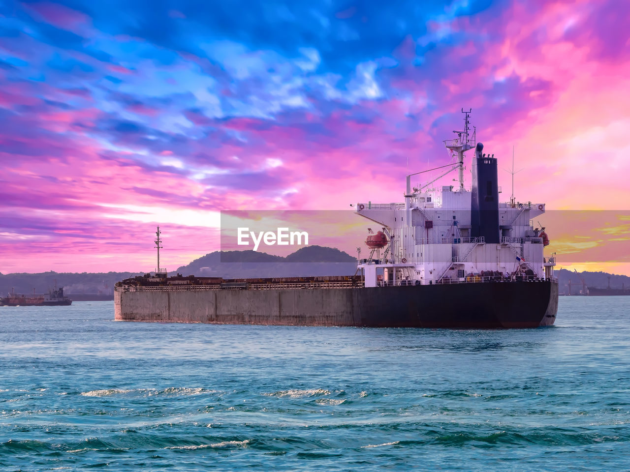 Bulk cargo vessel departure from port of thailand.