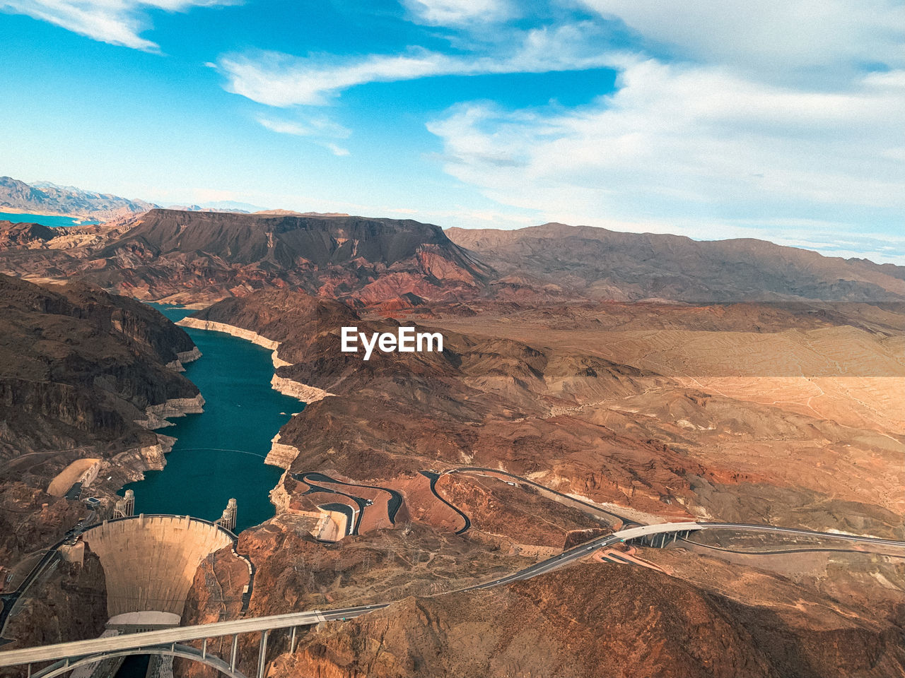 Aerial view of landscape against cloudy sky